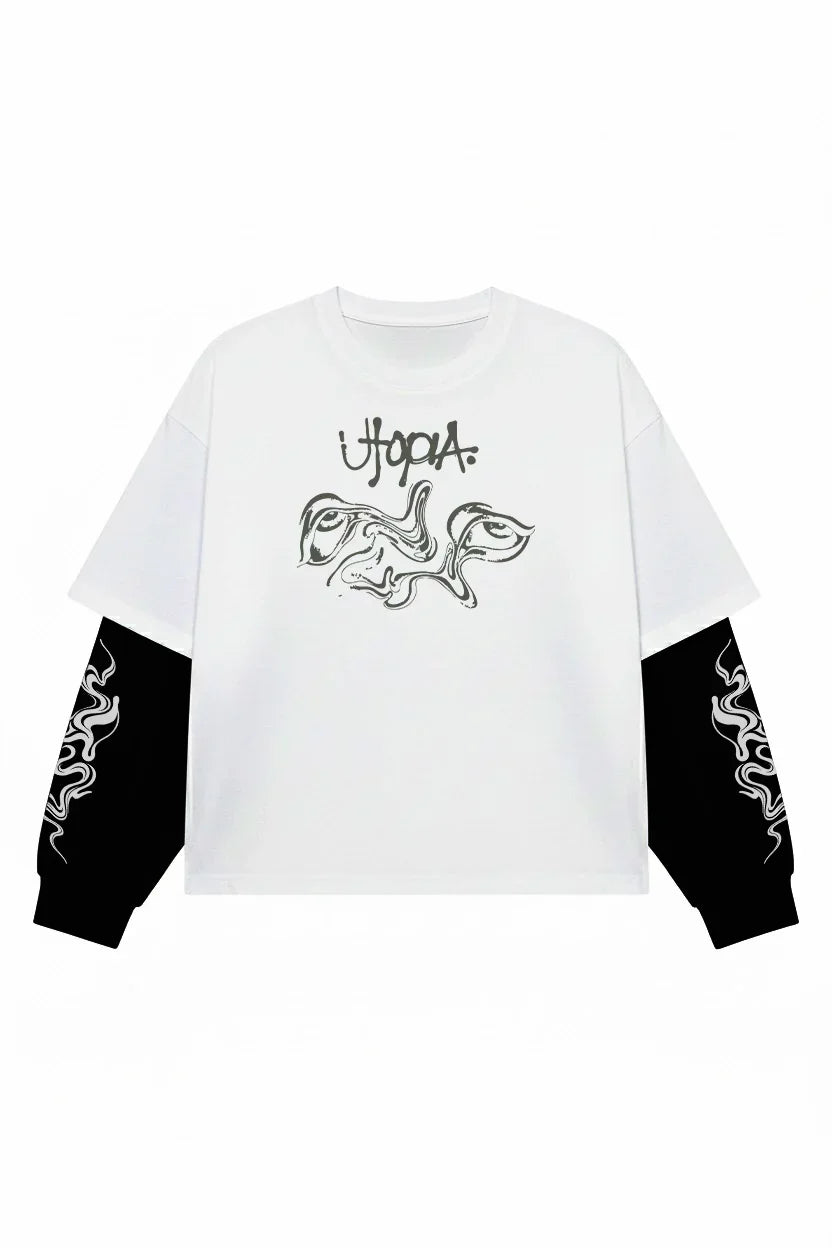 White and black Travis Scott Utopia Chaos LS Tee by Jnorss, featuring bold graphic design on the long-sleeve cotton shirt.