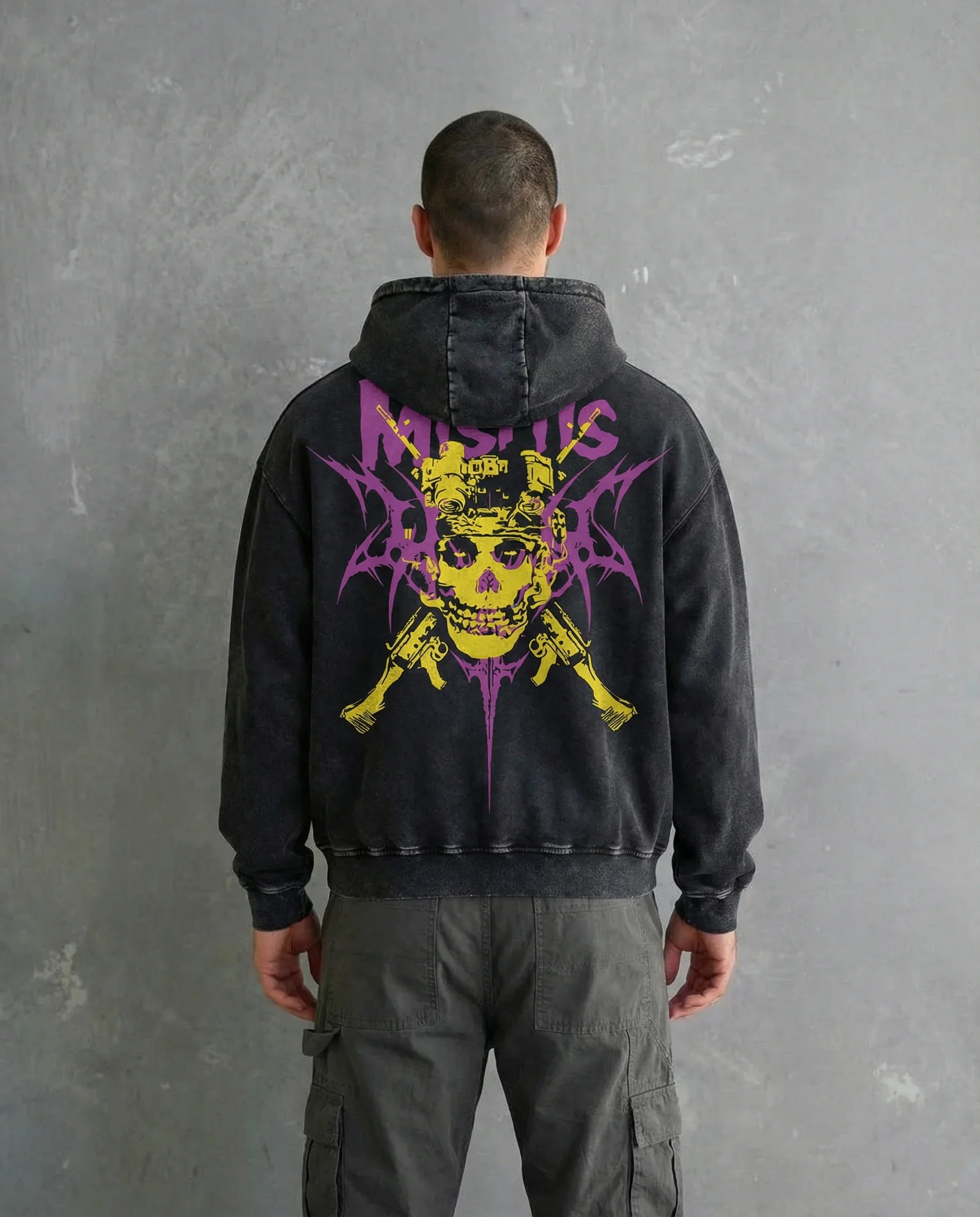 Back view of a model wearing a Jnorss Misfits Skull Uprising acid wash hoodie with a hood and distressed design.