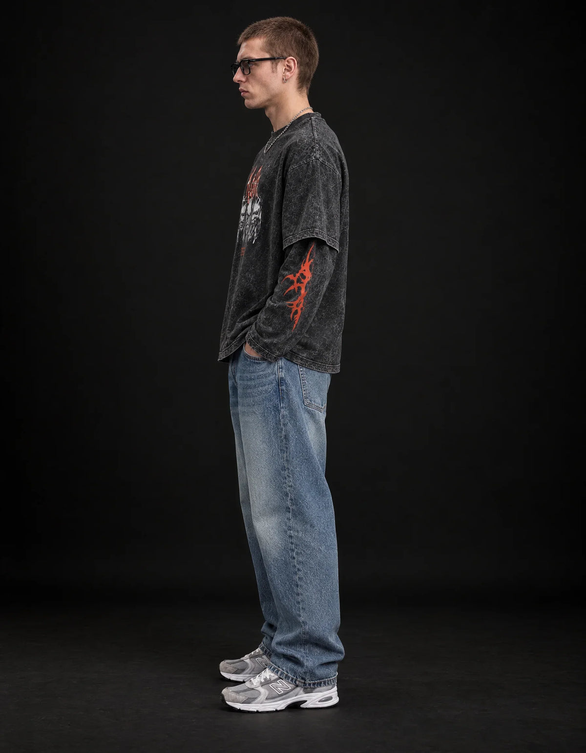 KORN Issues Acid Wash Layered Sleeve Oversized T-Shirt — side view on model showing layered sleeves