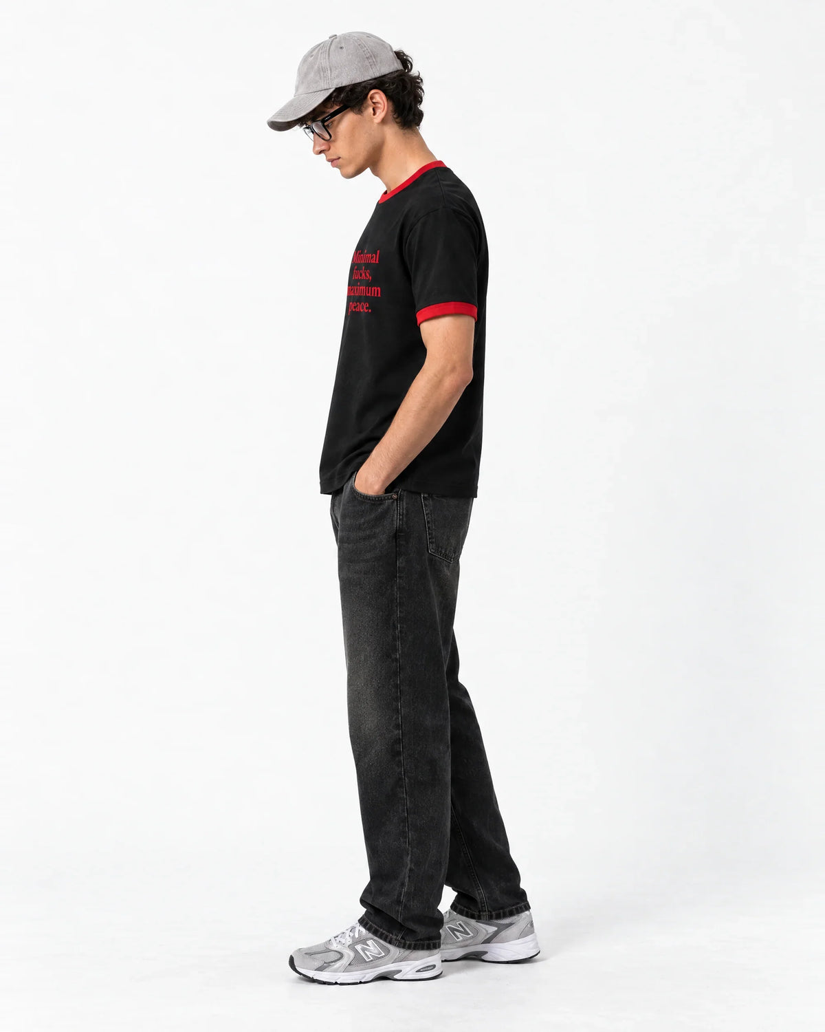 Minimal F*cks, Maximum Peace Ringer Tee — side view on model